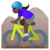 woman mountain biking, dark skin tone